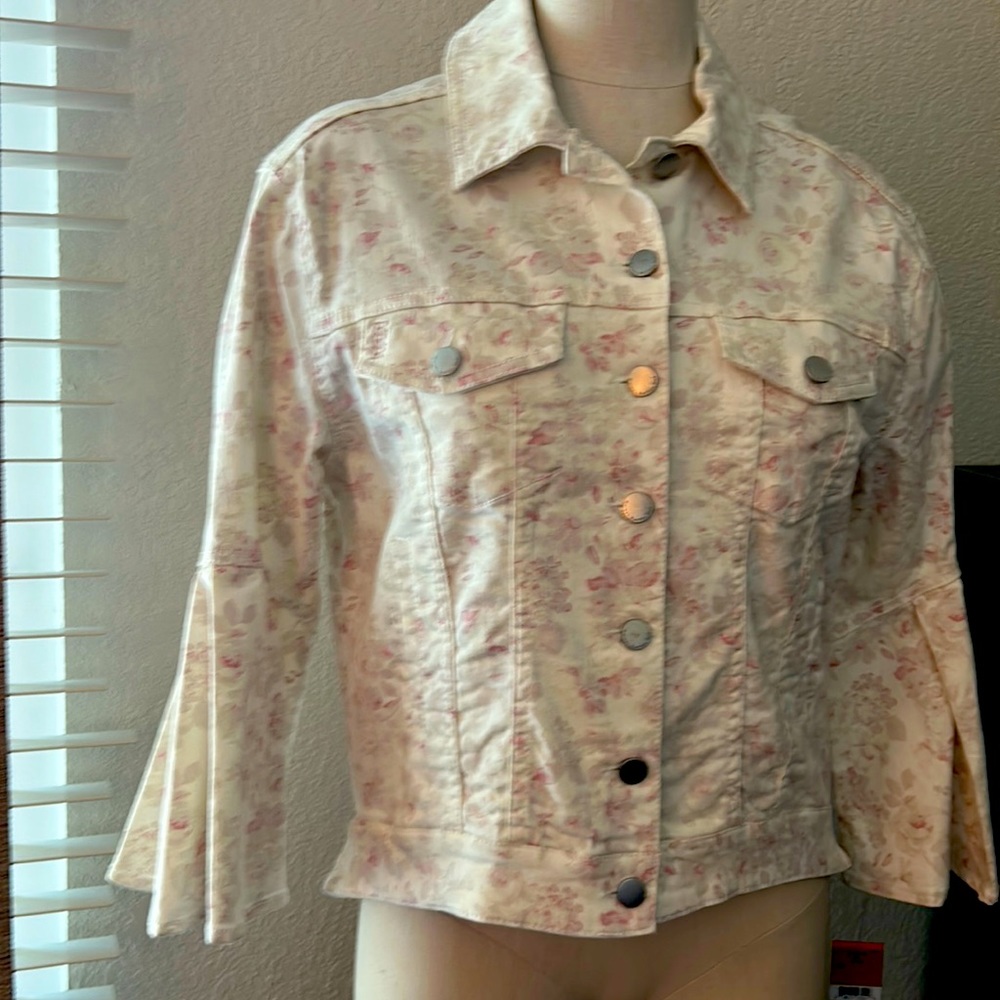 Like new jacket. soft "jean jacket" style. sleeves are 3/4 flared. Never Worn